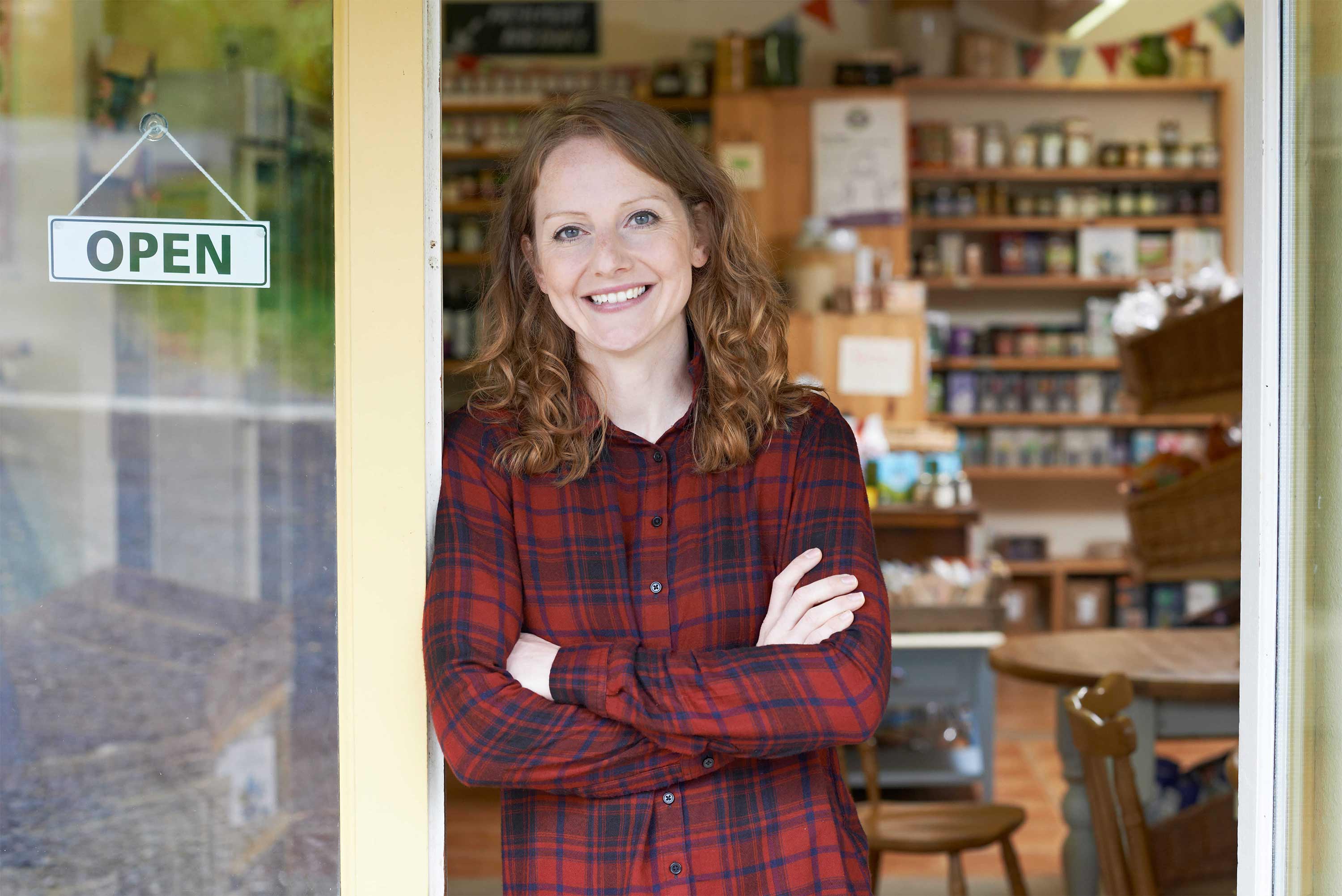 Woman in front of her shop